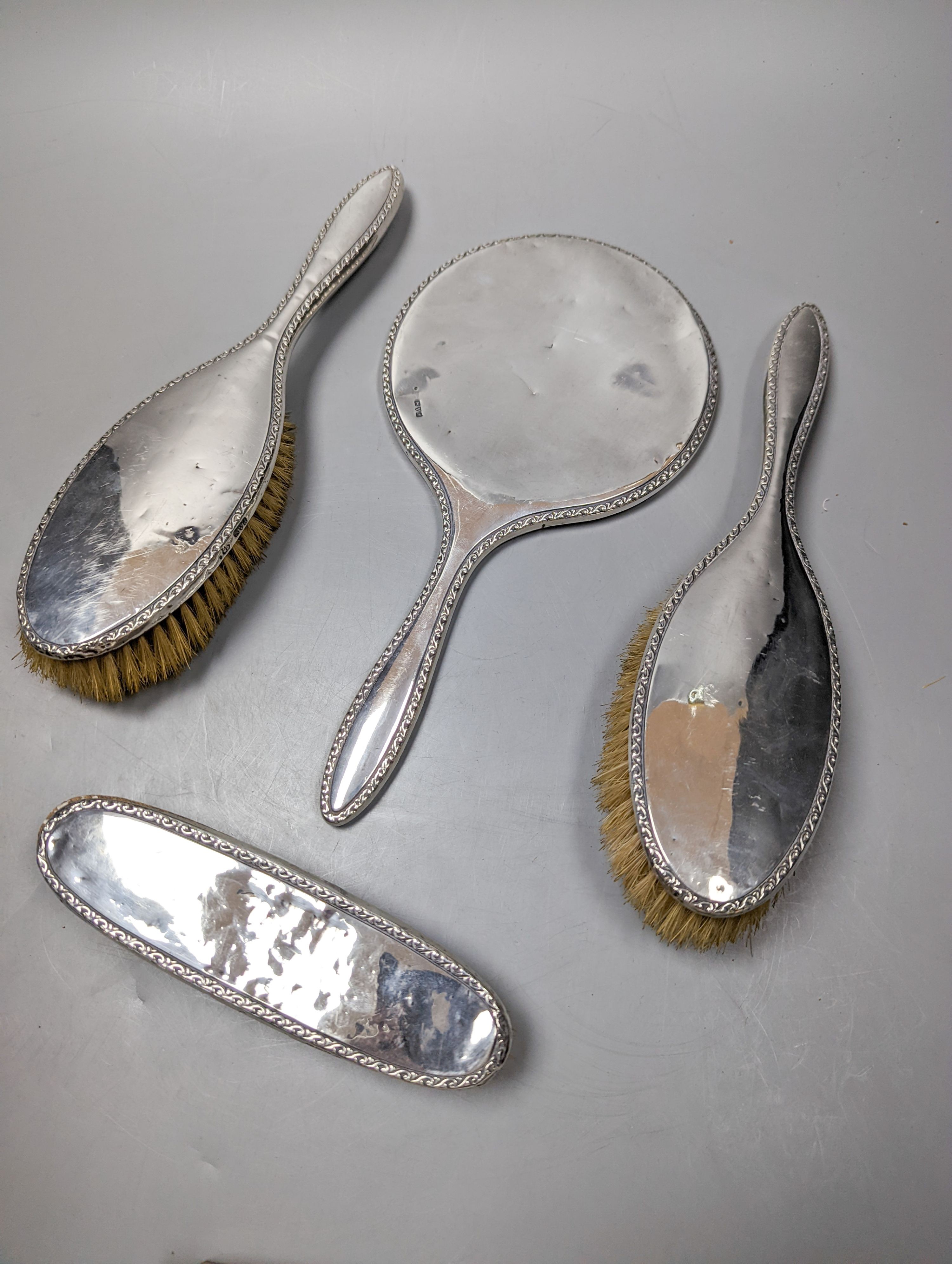 A George V silver mounted four piece mirror and brush set, Chester, 1917.